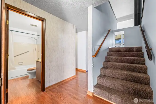 Durable flooring at the entry and through the bath & kitchen is a PLUS!  Stairs lead to the loft and 2nd bedroom.