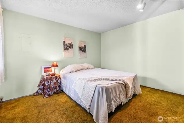 This is a Queen-size bed. A King should fit fine.