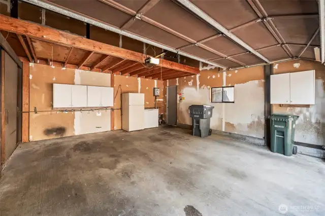 Garage has a 2nd refrigerator & a freezer, auto opener, storage room loft storage and upper cabinets.