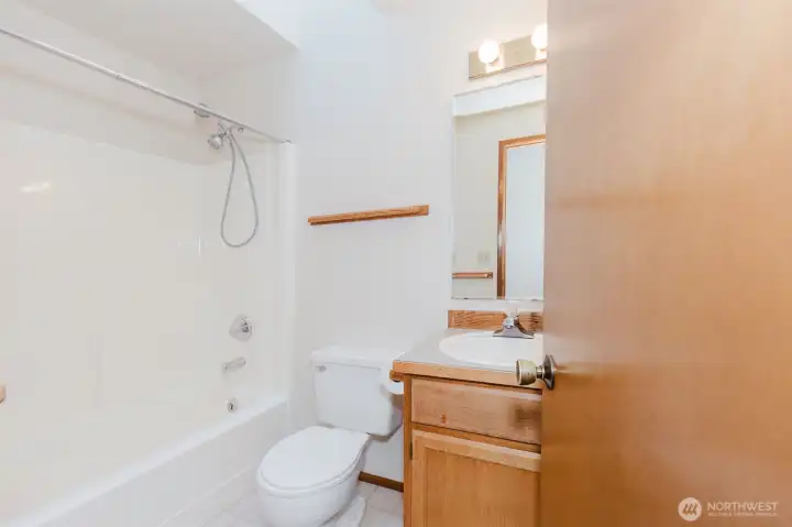 Bright and practical secondary bathroom with a tidy design and easy-care finishes