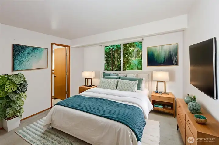 Spacious primary suite offering comfort, privacy, and a peaceful retreat. Virtually staged.
