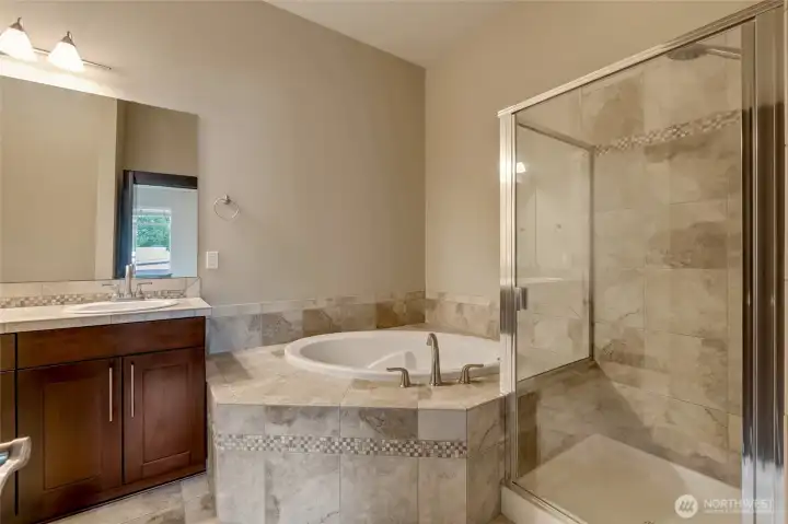 Primary suite features a grand 5 piece bathroom.