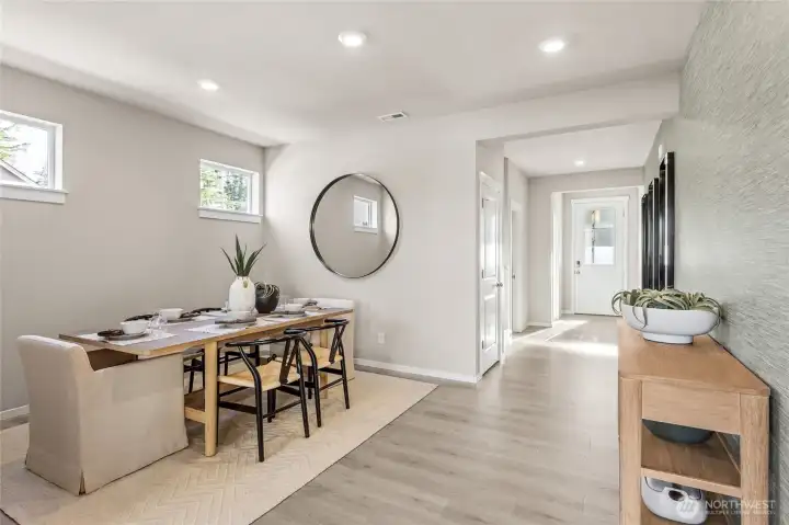 Large dining room for hosting dinner parties. Photo is representational. Actual home is under construction and colors, materials, and finishes may vary. See site agent for details.