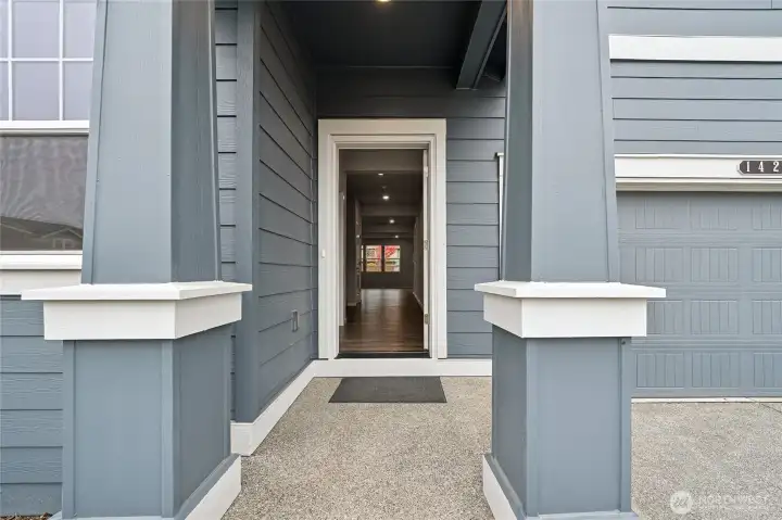 Covered front porch wow's at the entrance of the home. Photo is of actual home for sale. See site agent for details.