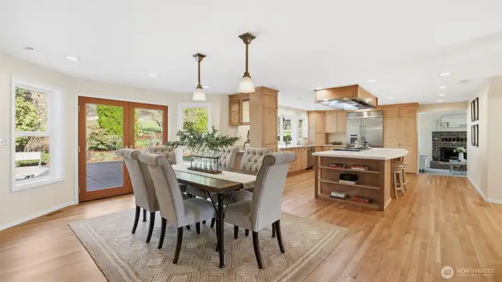 Oversized French doors lead to the large backyard patio. Refinished hardwood floors, fresh interior paint