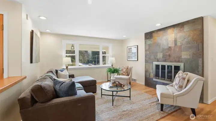 Family room features exquisite slate surround lending modern charm and architectural detail.