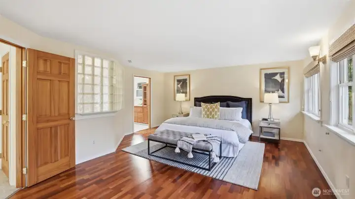 The upstairs primary suite provides a light-filled sanctuary.