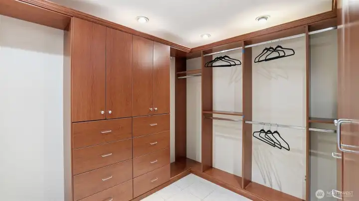 Large walk-in closet features California Closet inserts and heated floors. Just waiting to make your Pinterest worthy closet come to life.