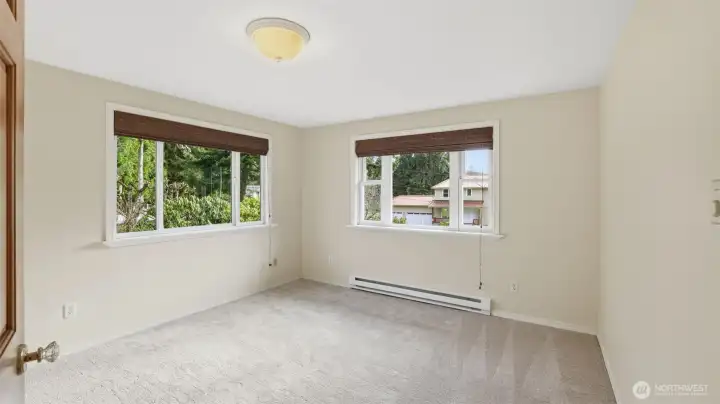 Another secondary upstairs bedroom with new carpet and plenty of light.