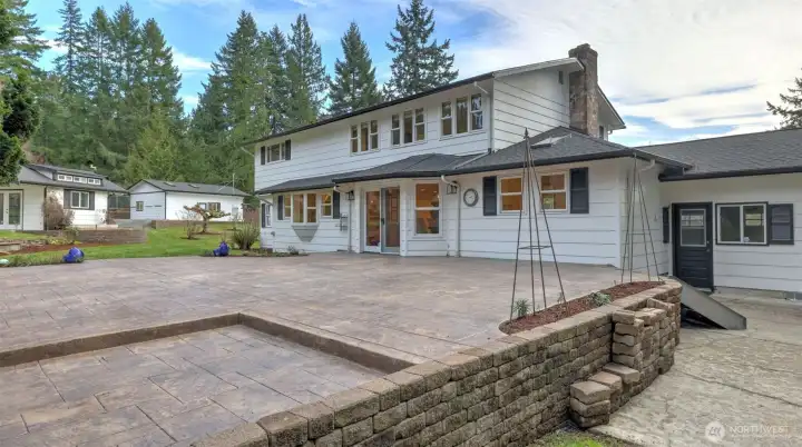 Attention to detail inside and out. Stamped concrete back patio features a gas stub for BBQ, wiring for future outdoor lighting, and a recessed area for an outdoor kitchen.
