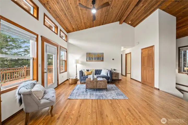 Down the hall to the 1/2 bath, den/office, and primary suite.