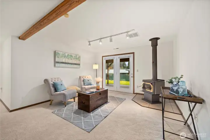 Warm up during the winter months with a woodstove or enjoy quick access to the backyard in the lower level bonus room.