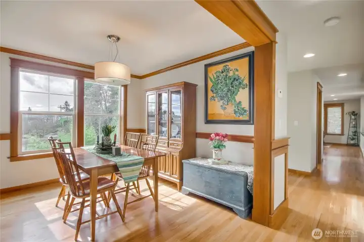 The sun-drenched formal dining room showcases sweeping southern territorial views.