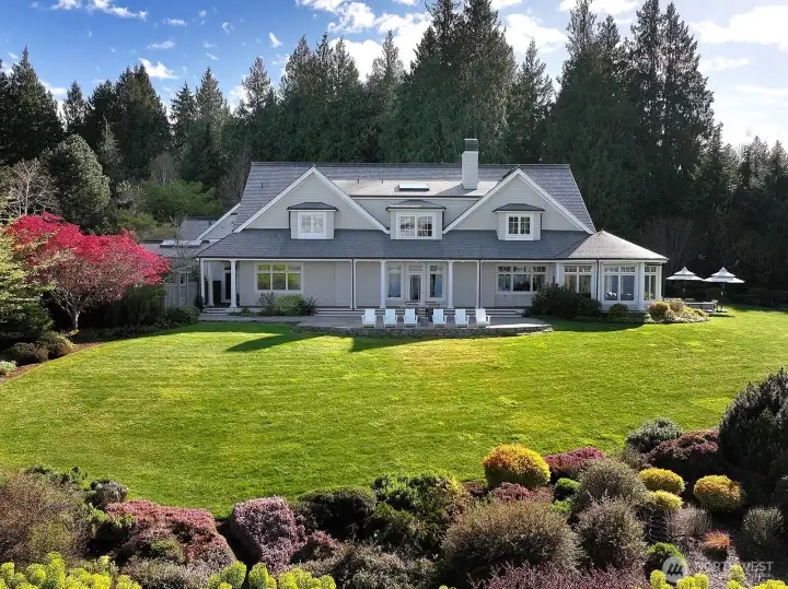 ~330 feet of waterfront on 9+ acres of expansive lawn, mature gardens and evergreens.