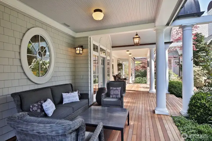 The covered wrap-around porch is well-lit, so you can take in the warm rainy days and soak in the twilight colors in comfort.