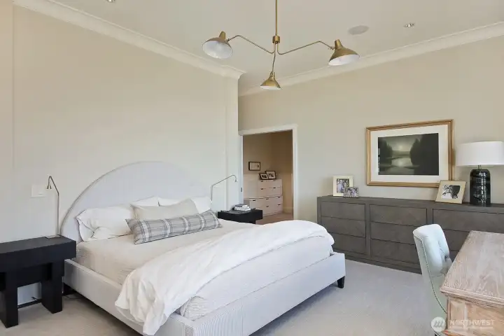 The primary suite includes a sitting room, dressing room, dual walk-in closets, private balcony, and sumptuous en-suite bath.