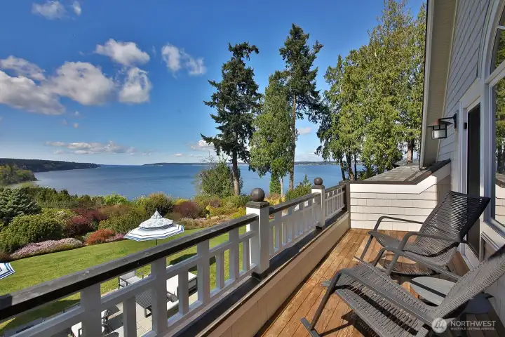 The balcony off the primary suite is a perfect spot for morning coffee.