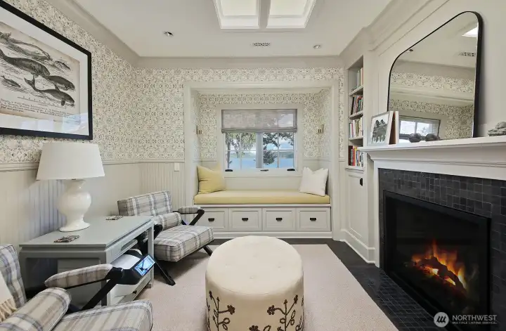 Such a charming, cozy room to end the day in the primary suite.