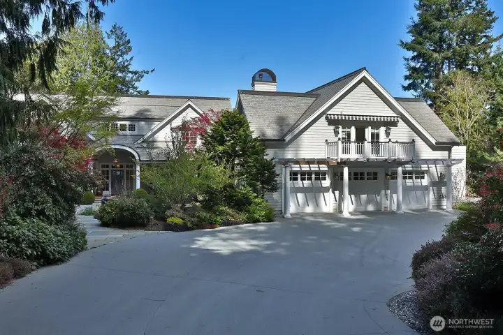 Three-car garage with space upstairs that can be used as an office or for guest overflow.