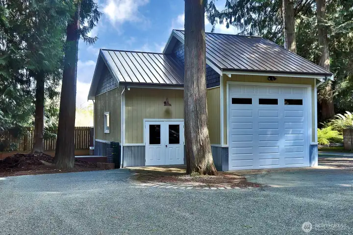 Secondary garage with oversized door and workshop.