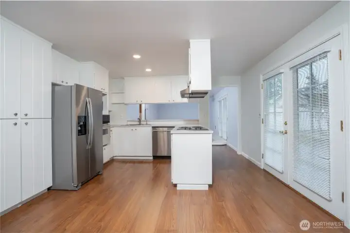 Centrally located between the formal dining and family room, the kitchen provides great flow and convenience.