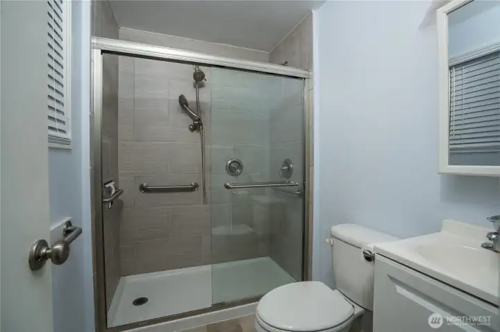 Enjoy a tiled shower in the primary bathroom, adding style and elegance.