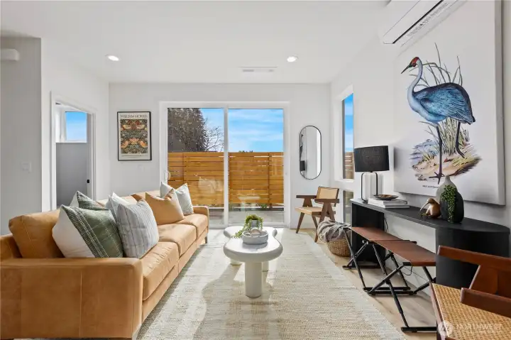 Main living space with sliding doors to the patio and backyard