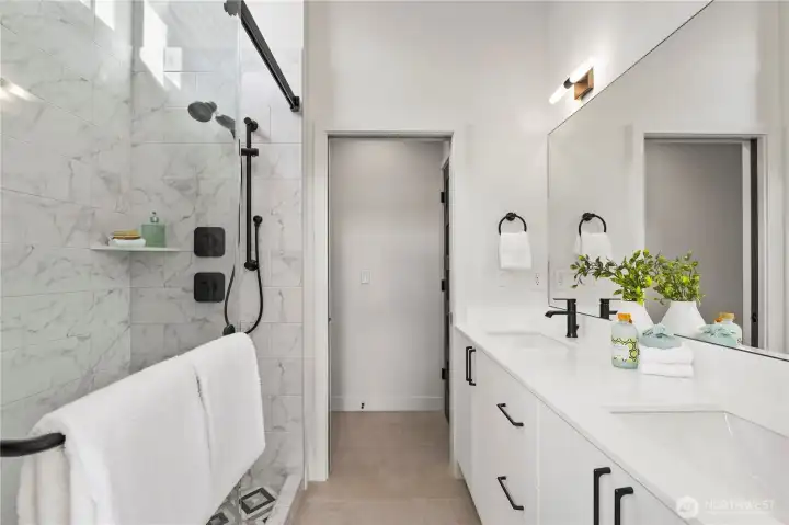 Large ensuite bathroom with high end finishes