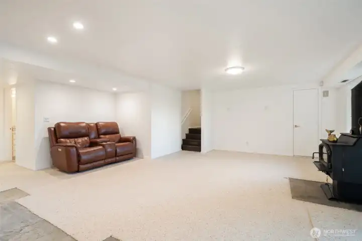 Downstairs to Massive Living Room with Wood Burning Stove