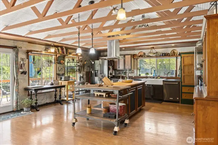 Open and airy kitchen with exposed beams, charm, and lots of natural light.