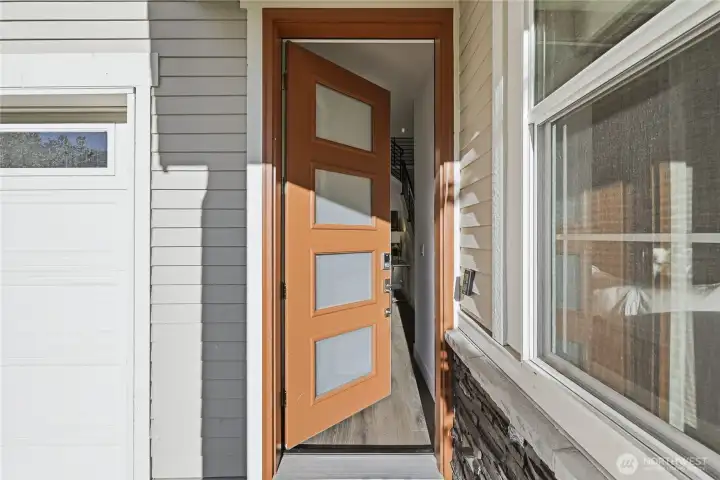 Bathed in natural light, the inviting entry sets a warm and welcoming tone from the start.