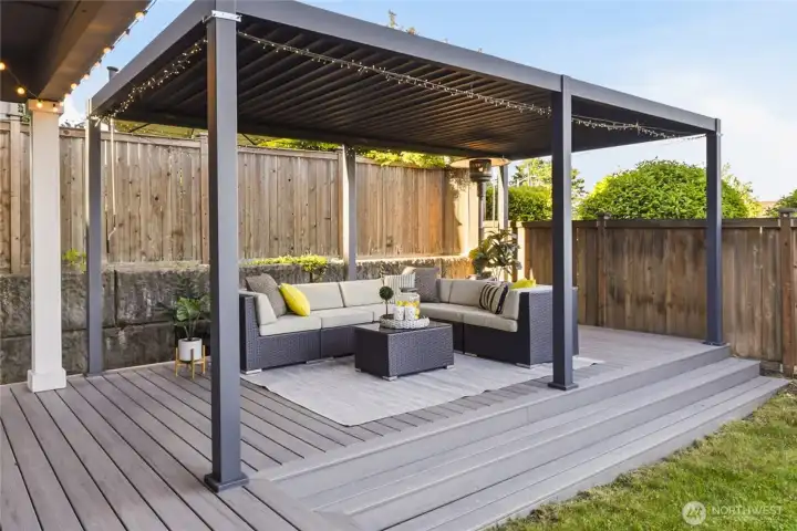 Louvered pergola allows for year-round enjoyment, while the composite deck offers beautiful low-maintenance outdoor living.