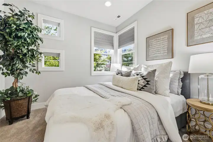 Main-floor bedroom and full bath offer flexibility for guests, multigenerational living, or a private office.