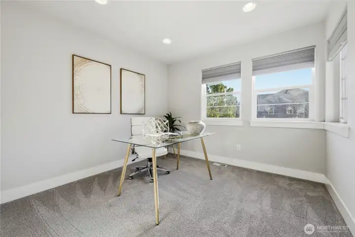 Fifth bedroom currently staged as a home office, offering flexible use to suit your needs.