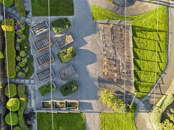 Aerial view of one of the HOA-maintained amenities: the pea patch, with the community dog run located just beyond the visible area.