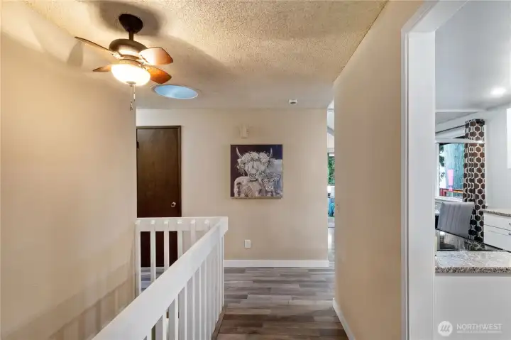 Upper hallway with skylight & natural light
