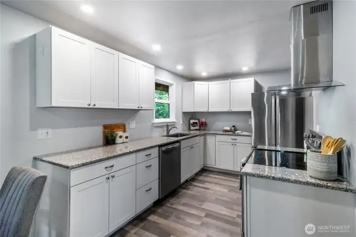 Bright updated kitchen with abundant cabinetry