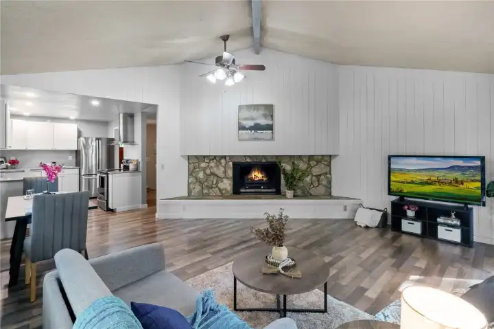 Spacious living area with fireplace & vaulted ceilings