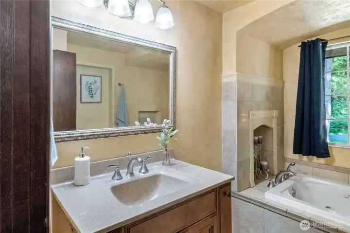 Main bathroom with soaking tub & updated vanity
