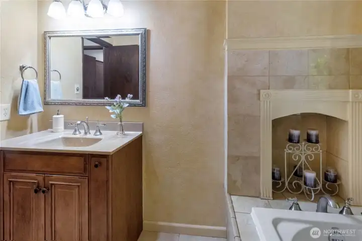 Updated vanity & tiled tub surround