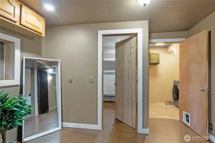 Lower-level area has walk-in closet and laundry access
