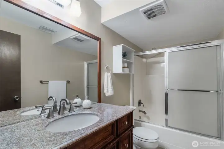 Lower level bathroom with updated vanity and tub/shower