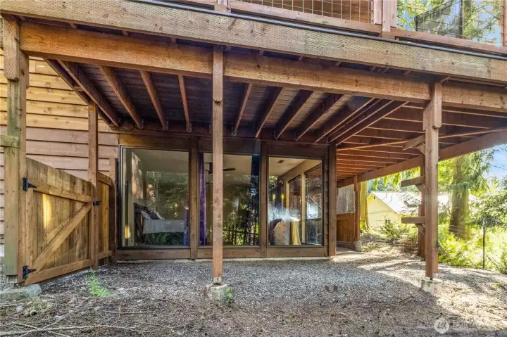 Covered lower patio area beneath upper deck