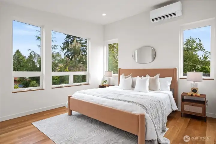 Primary suite with vaulted ceilings and expansive windows. Photo of model unit, 4118. Finishes may vary, buyer to verify.