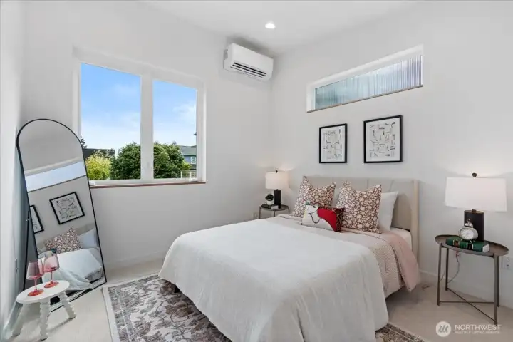 The second bedroom has vaulted ceilings, large windows and mini-splits for heating and cooling. Photo of model unit, 4118. Finishes may vary, buyer to verify.