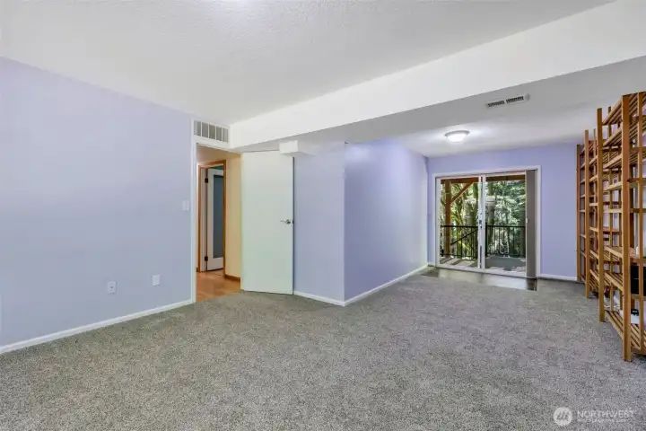 Lower level family room--note slider out to a two-tiered deck