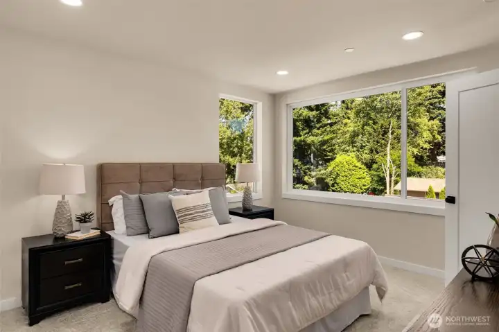 Bright and airy bedroom suite with large windows welcoming in exceptional natural light. (photos are of model home- similar finishes and layout) Bright and airy bedroom suite with large windows welcoming in exceptional natural light. (photos are of model home- similar finishes and layout)