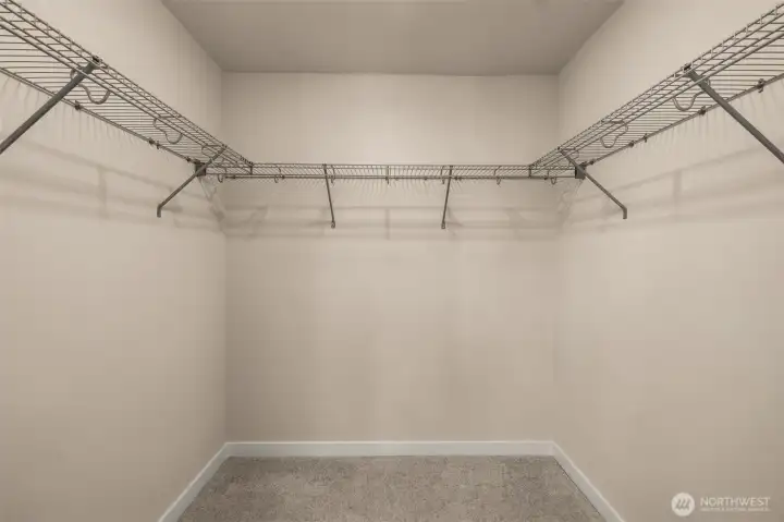 Primary includes a walk-in closet. (photos are of model home- similar finishes and layout) Primary includes a walk-in closet. (photos are of model home- similar finishes and layout)