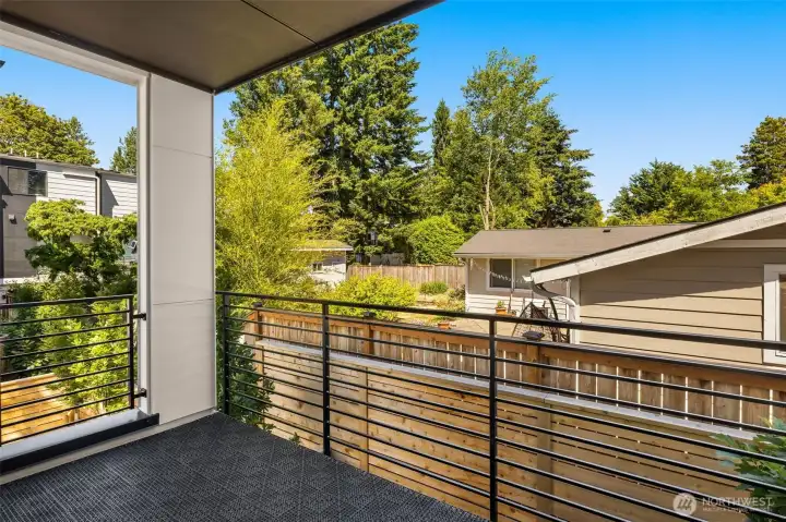 Private deck area overlooking lush greenery, offering a peaceful setting for morning coffee or evening relaxation. (photos are of model home- similar finishes and layout) Private deck area overlooking lush greenery, offering a peaceful setting for morning coffee or evening relaxation. (photos are of model home- similar finishes and layout)
