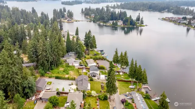 Large approx 2/3 acre lot on Lake Tapps Oasis. Gorgeous remodeled home, shop with potential for ADU and private 85' of waterfront with dock, boat launch and outbuilding with power and water. WA summers don't get any better than this!